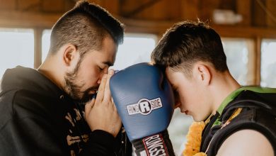 two men praying inside room