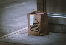 brown paper bag on gray concrete floor