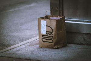 brown paper bag on gray concrete floor