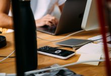 person using silver MacBook