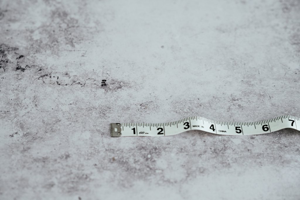 white measuring tape on white surface