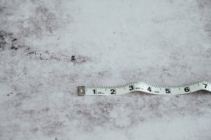 white measuring tape on white surface