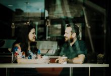 couple drinking coffee inside coffee shop