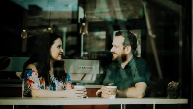 couple drinking coffee inside coffee shop