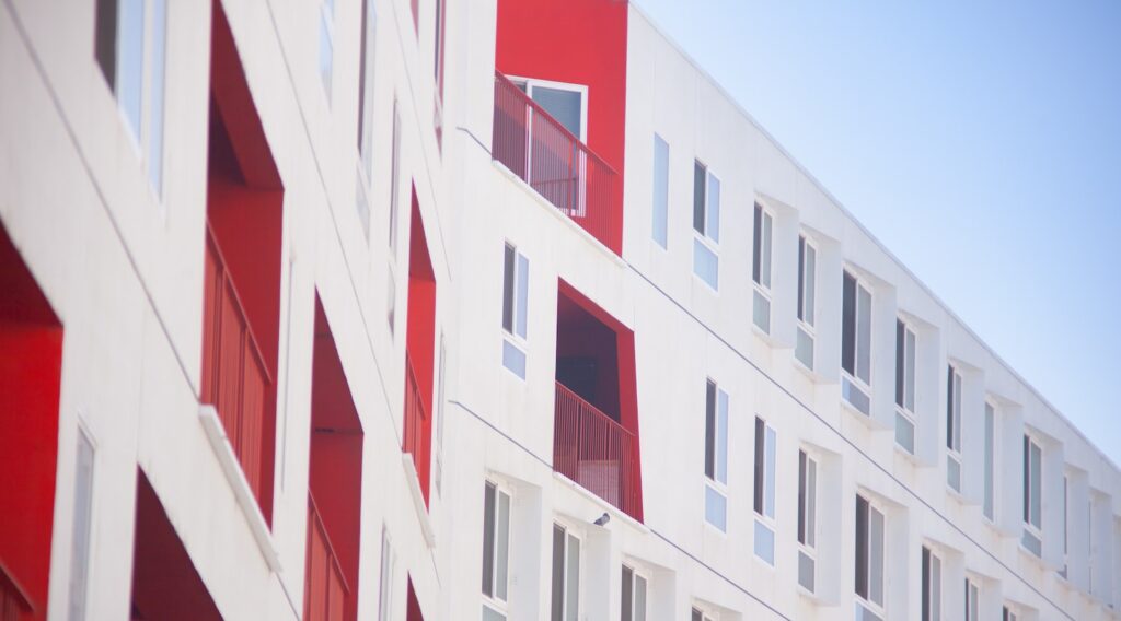 white and red concrete building atime