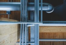 white metal railings near white concrete building during daytime