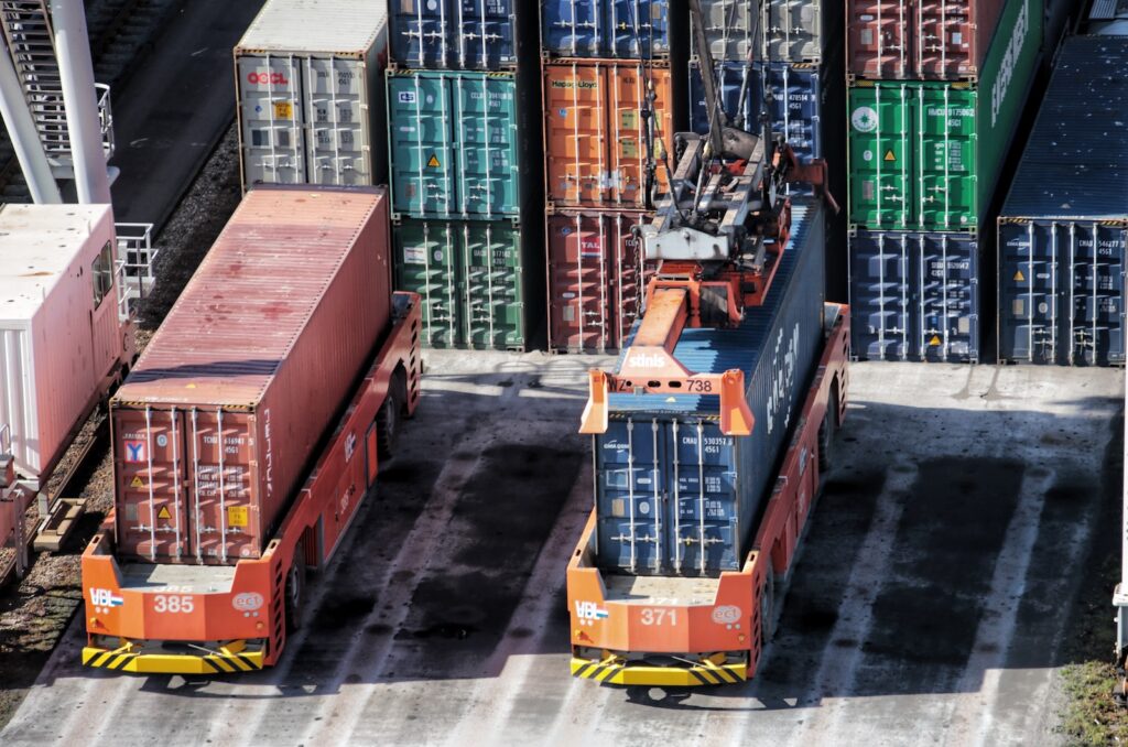 cargo containers are stacked on top of each other