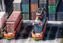 cargo containers are stacked on top of each other