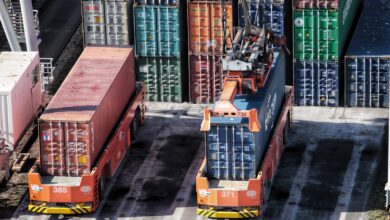 cargo containers are stacked on top of each other