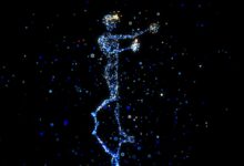 a person standing in the air with a star in their hand