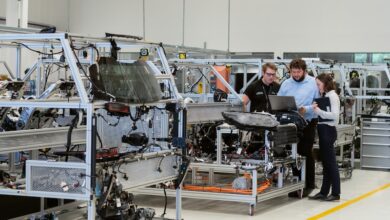 man in black jacket sitting on black chair