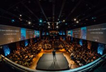people sitting on chairs watching a game