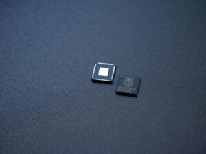 a couple of microchips sitting on top of a table
