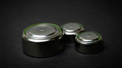 a group of three batteries sitting on top of a table