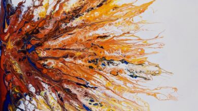 a painting of orange and blue leaves on a white background