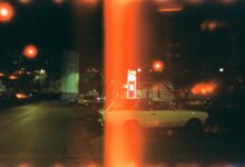 white sedan on road during night time