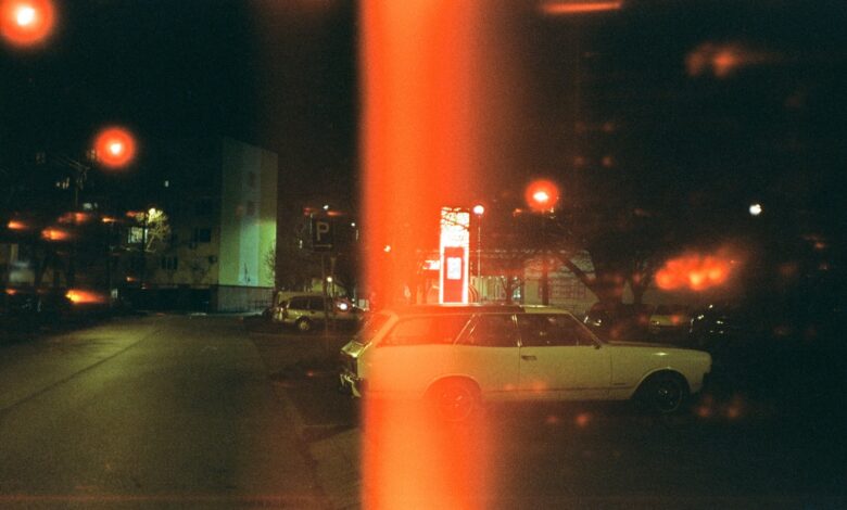 white sedan on road during night time