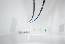 white hallway and wall with turned-on light fixture