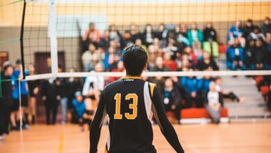 man wearing black 13 volleyball jersey