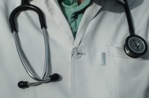 person in white and black stethoscope