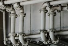 grayscale photography of metal pipes