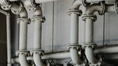 grayscale photography of metal pipes