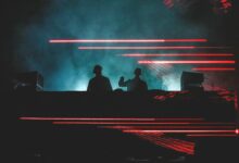 two men standing in front of smoke