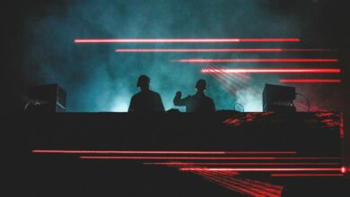 two men standing in front of smoke