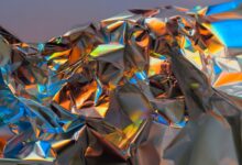 a close up of a shiny surface with a blue sky in the background