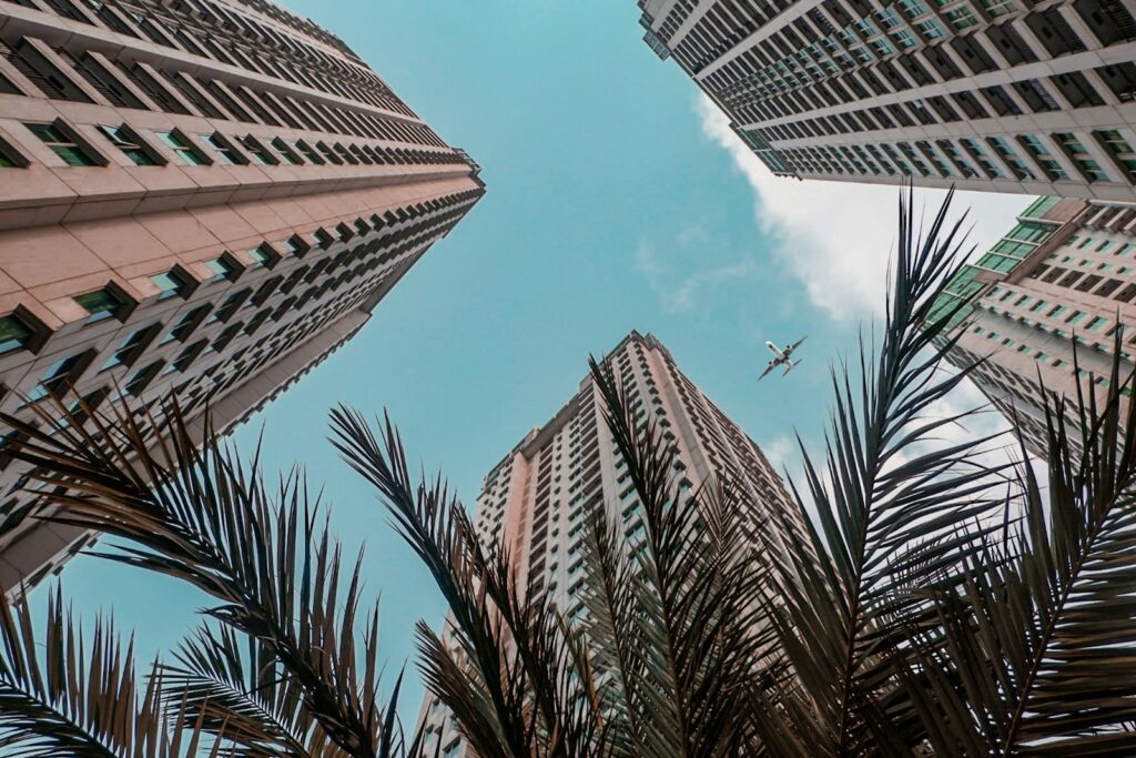 worm's view of commercial buildings and airplane