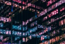architectural photography of building with people in it during nighttime