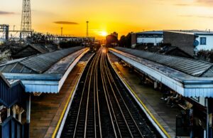 photo of brown train track at sunset