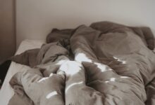 brown and white bed linen