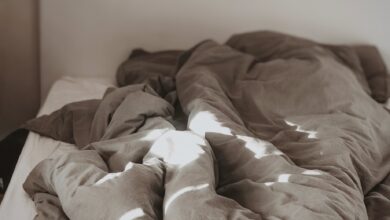 brown and white bed linen