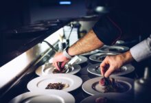person preparing cooked dish