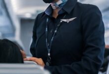 man in black suit jacket wearing mask