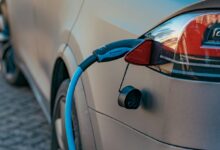 red and black car on road during daytime
