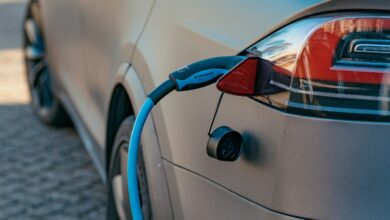red and black car on road during daytime