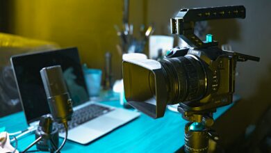 a laptop computer sitting on top of a wooden desk