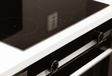 A black and white photo of a stove top oven