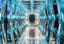 a very long hallway with a lot of mirrors on it