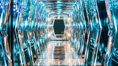 a very long hallway with a lot of mirrors on it