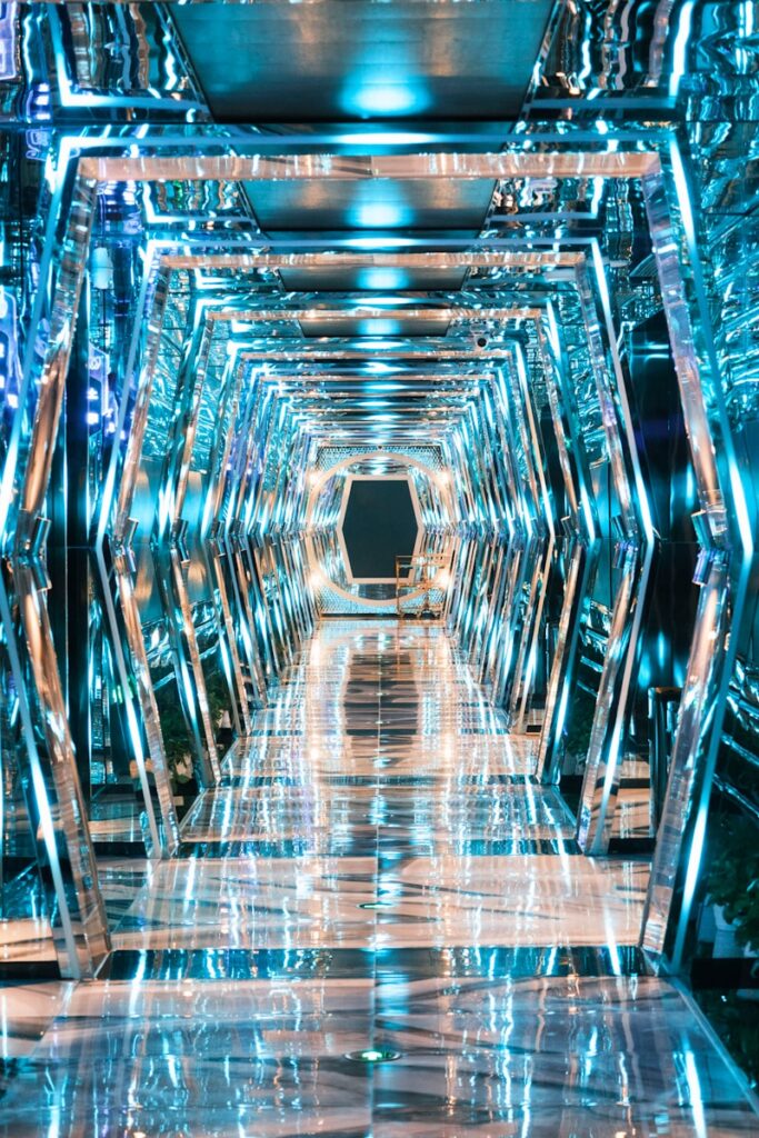 a very long hallway with a lot of mirrors on it