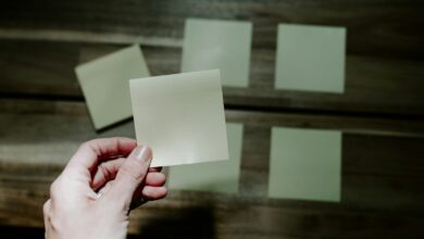 a hand holding a piece of paper