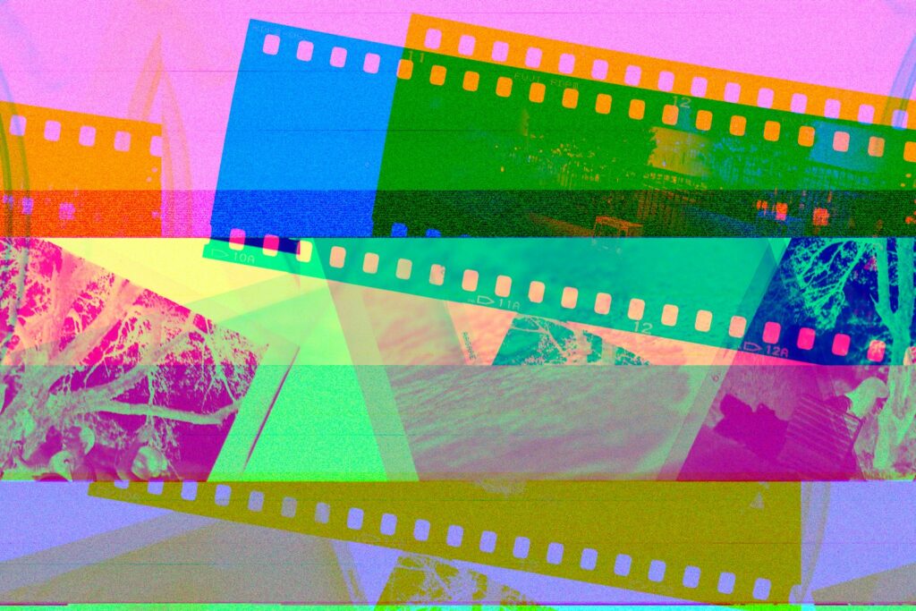 a multicolored film strip with a picture of a mountain in the background