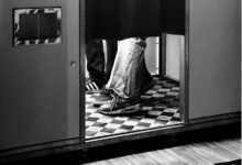Person's legs inside a photo booth