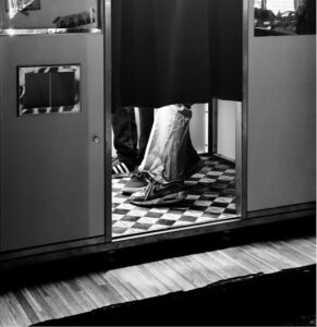 Person's legs inside a photo booth